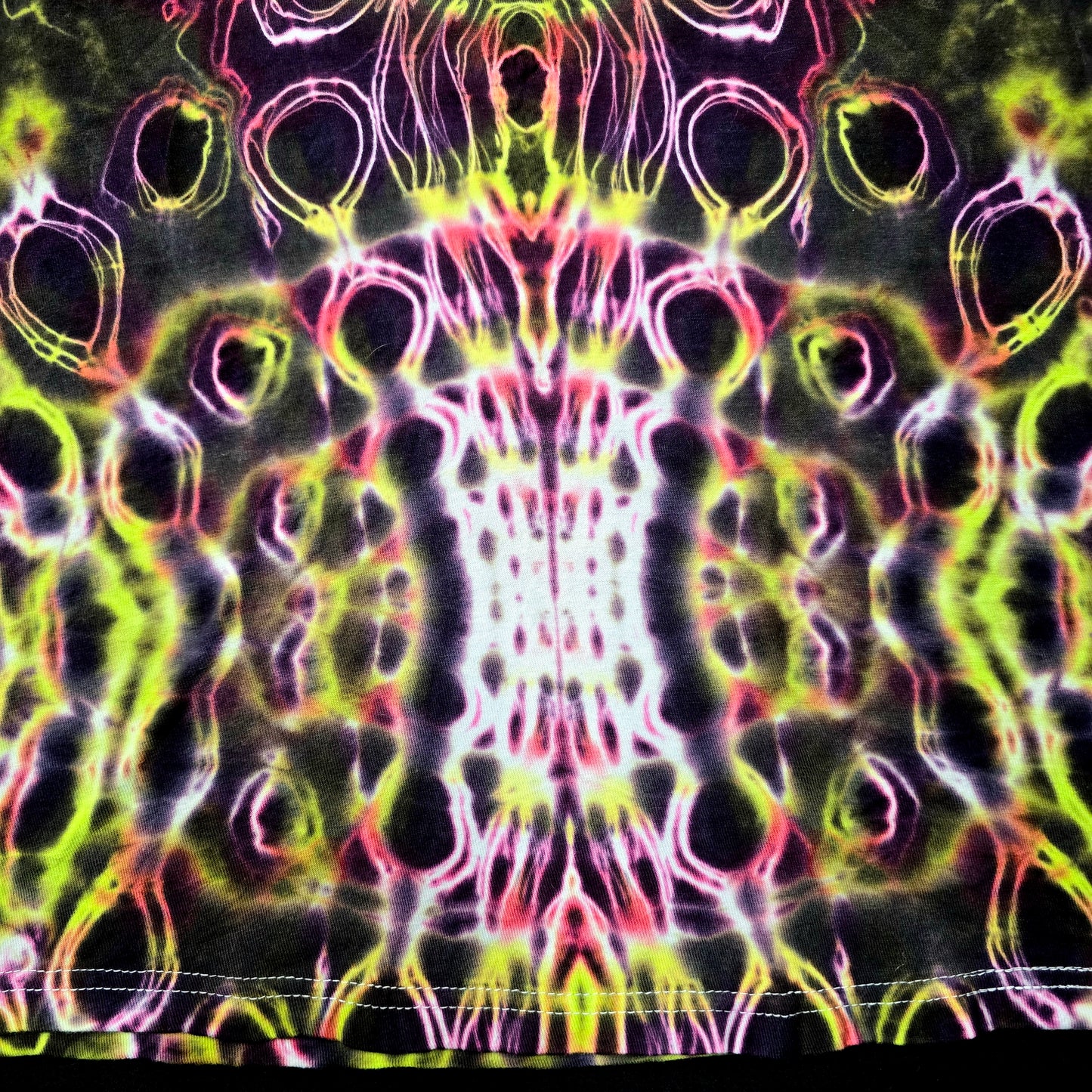 Detailed view of bottom spine dye work with cellular textures and mirrored saturation