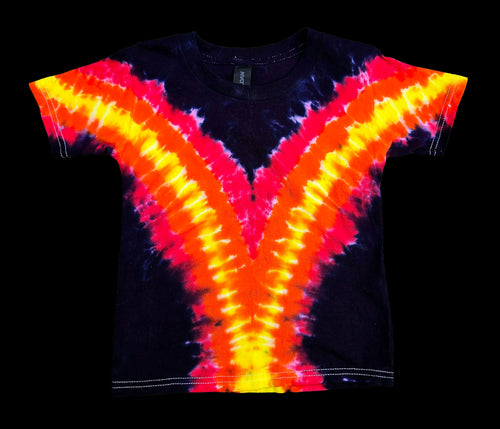 A short-sleeve tie-dye t-shirt with a vibrant V-shaped pattern in neon yellow, orange, and red over a black base, shown flat against a solid black background.