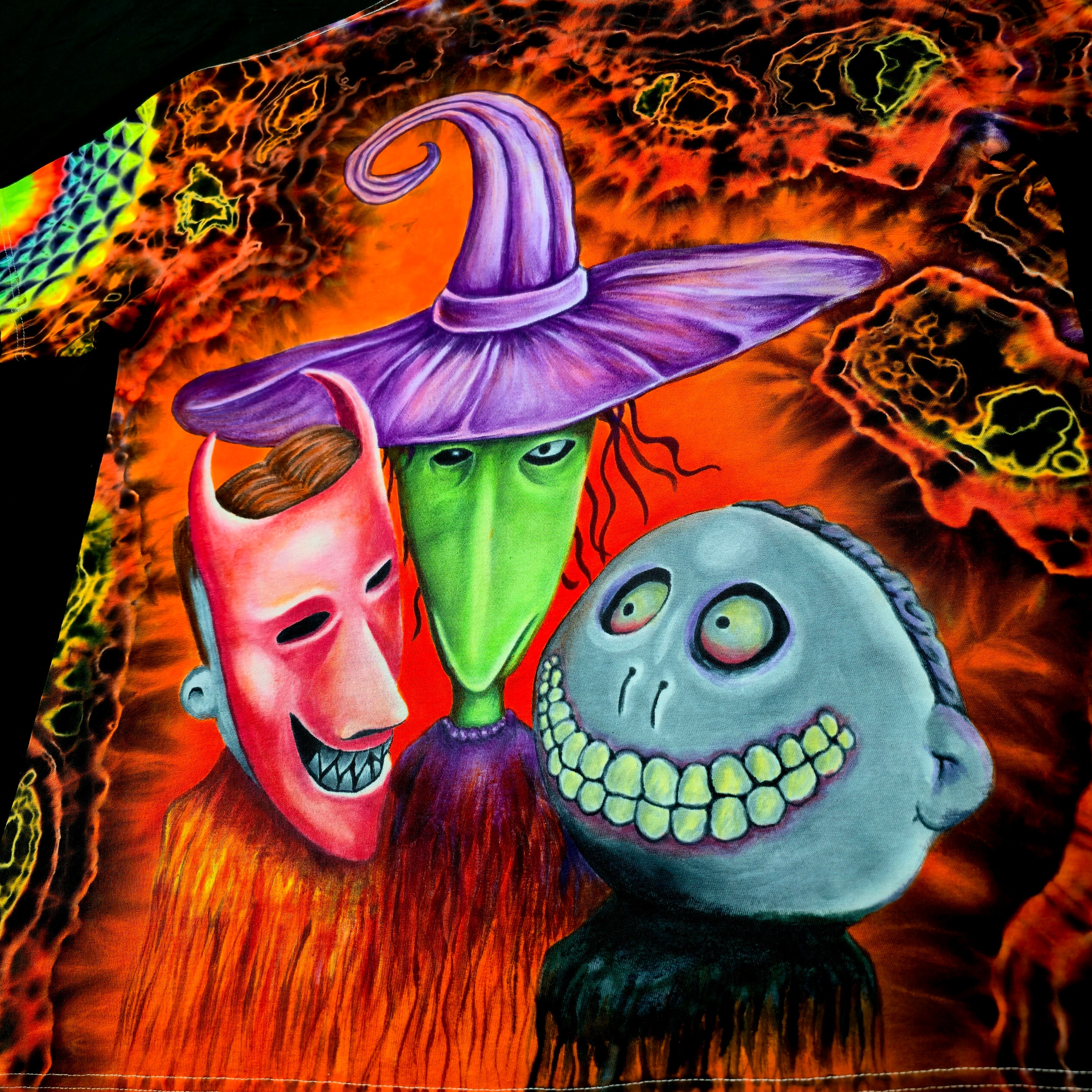 Colorful Halloween-themed tie-dyed t-shirt  with a mischievous trio of trick-or-treaters