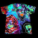 A short-sleeve crewneck t-shirt featuring a vibrant, multicolor neon tie-dye pattern with concentric geode-like shapes in purple, green, blue, orange, and red on a black background.