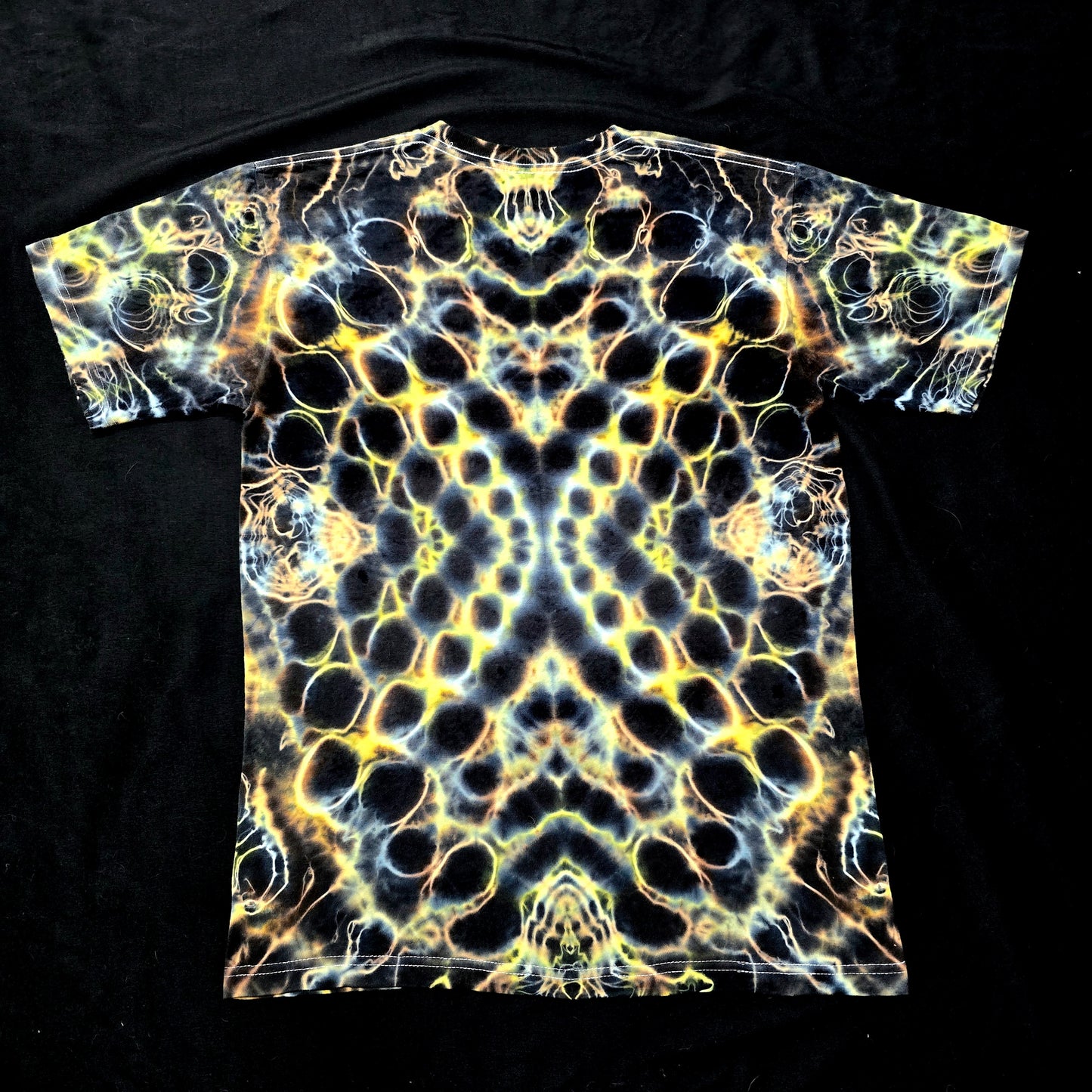 One-of-one Amber Flux tie-dye shirt featuring symmetrical organic pattern, back view