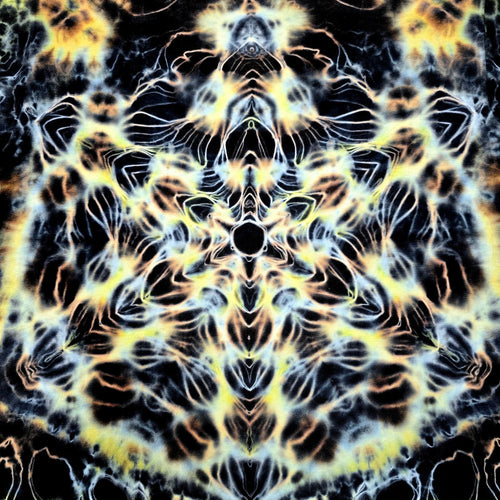 Mandala pattern with black, yellow, and white colors on a dark background