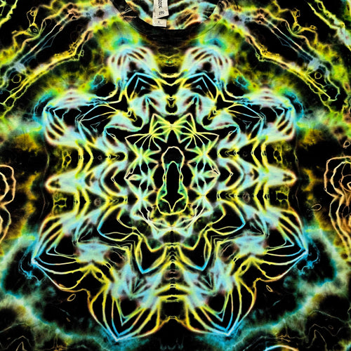 A highly symmetrical, kaleidoscopic abstract pattern with neon yellow, green, and cyan glowing linework over a black background, filling the entire frame.