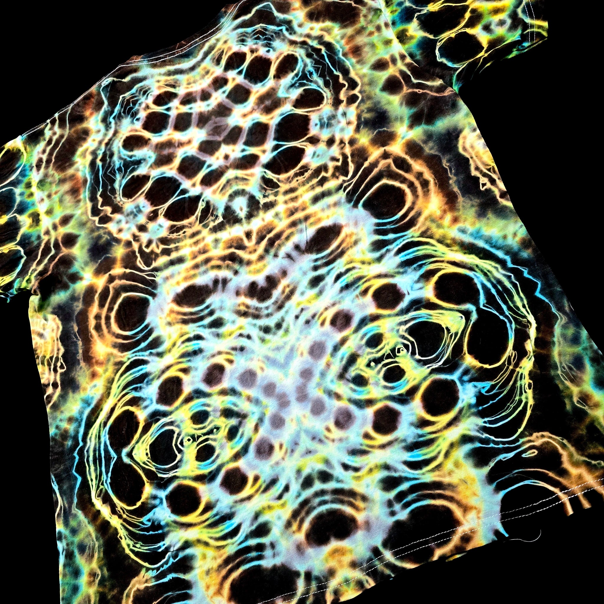 T-shirt with a vibrant, multicolored abstract pattern on a black background