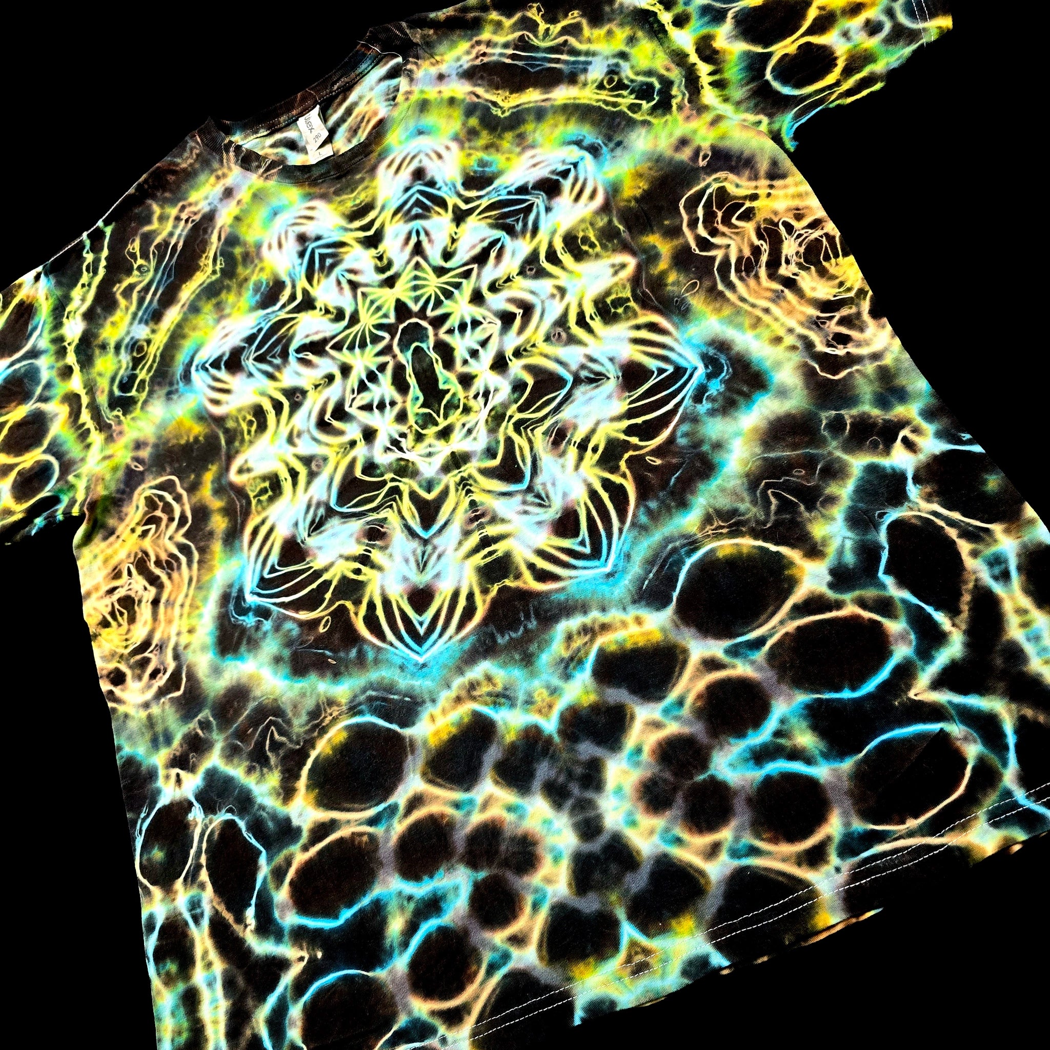 Angled front view of handmade tie-dye tee featuring layered aurora-like color flow