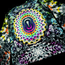 A long-sleeve shirt with a highly vibrant, psychedelic tie-dye pattern featuring a large central mandala design in rainbow colors on a black base.