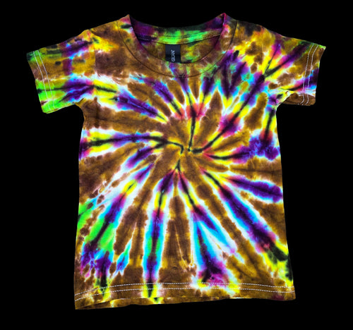 A short-sleeve crewneck t-shirt featuring a vibrant spiral tie-dye pattern with brown, yellow, purple, green, and blue colors, displayed against a solid black background.