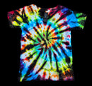 A short-sleeve tie-dye t-shirt with a vibrant spiral pattern in blue, green, yellow, orange, red, and black, laid flat against a solid black background. A brand tag for 'Society6' is visible at the collar.