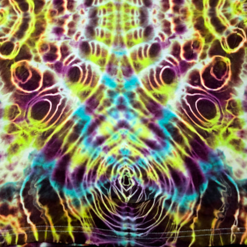 A close-up of a tie-dye fabric with a highly symmetrical, psychedelic pattern featuring neon yellow, green, purple, blue, and orange wavy lines and circular motifs.