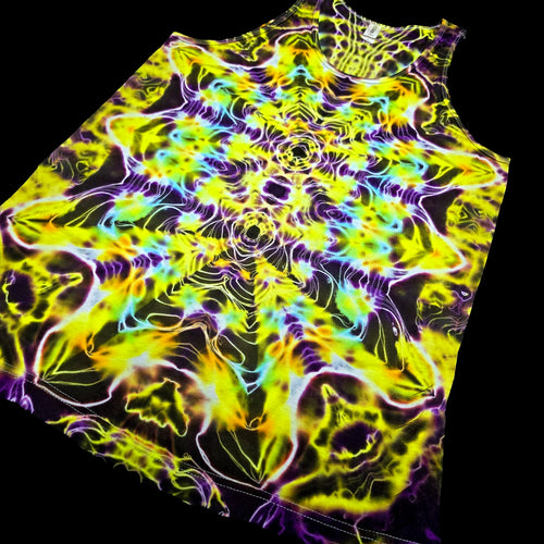 A sleeveless tank top laid flat on a black background, featuring a highly vibrant psychedelic tie-dye pattern with neon yellow, green, purple, blue, and orange abstract flame-like swirls radiating from the center.