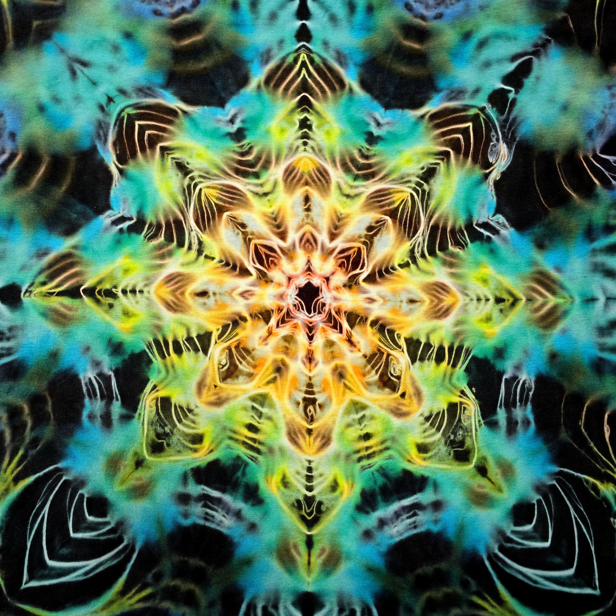 A symmetrical kaleidoscope pattern with layered star-like and floral mandala shapes in bright yellow, green, teal, blue, and black.