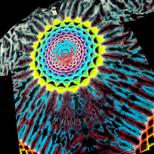 A short-sleeve tie-dye T-shirt featuring a vibrant psychedelic spiral mandala design in neon yellow, green, pink, blue, and purple on a black base.