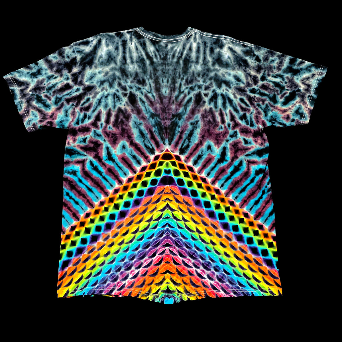 A short-sleeve tie-dye T-shirt with a highly symmetrical, kaleidoscopic rainbow pattern radiating from the hem, shown flat against a solid black background.