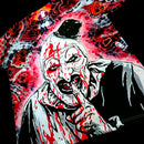 A close-up of a graphic print featuring a horror clown character with blood splatters, set against a swirling red, black, and white background.