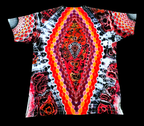 A short-sleeve t-shirt with a vibrant, symmetrical tie-dye pattern featuring concentric hexagonal dots and abstract organic shapes in red, orange, yellow, purple, and black on a white background, shown flat against a solid black backdrop.
