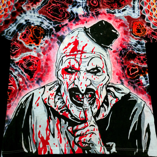 Close up macro view of hand painted Art the Clown face with black top hat and blood splatters
