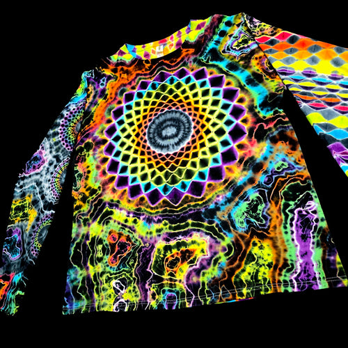 A long-sleeve crewneck shirt featuring a highly vibrant, psychedelic tie-dye pattern with a large mandala design on the front and geometric patterns on the sleeves, shown against a solid black background.