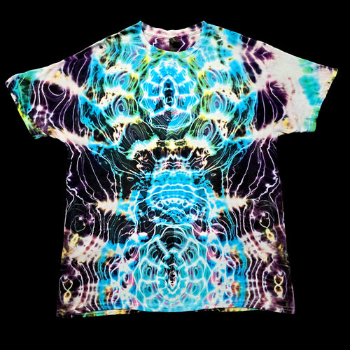 A short-sleeve crewneck t-shirt featuring a vibrant, symmetrical psychedelic tie-dye pattern with swirling waves of blue, purple, yellow, and white on a black base, presented flat against a solid black background.