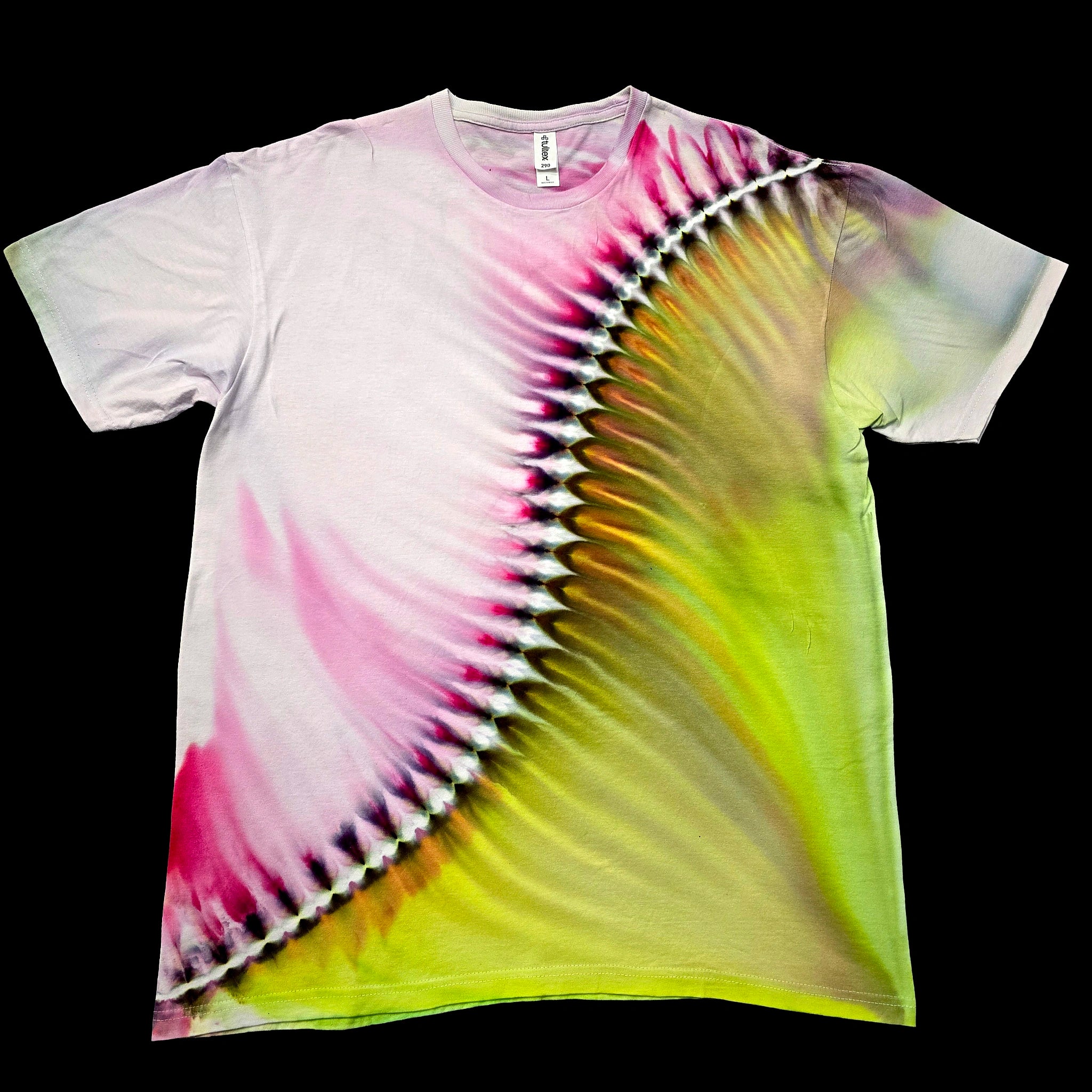 A short-sleeve crewneck tie-dye t-shirt laid flat against a solid black background. The shirt features a spiral tie-dye pattern transitioning from white on the left, through vibrant pink, to a bright neon yellow-green on the right.