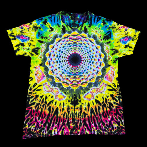 A short-sleeve crewneck t-shirt featuring a vibrant, symmetrical psychedelic mandala tie-dye pattern in neon yellow, green, blue, pink, and purple on a black background.