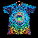 A short-sleeve tie-dye t-shirt hanging on a pink hanger against a solid black background. The shirt features a vibrant, symmetrical psychedelic spiral mandala pattern in blue, green, yellow, orange, and purple.