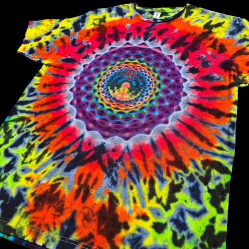 A short-sleeve crewneck t-shirt featuring a vibrant psychedelic spiral tie-dye pattern with neon yellow, green, orange, red, purple, and black, shown against a solid black background.