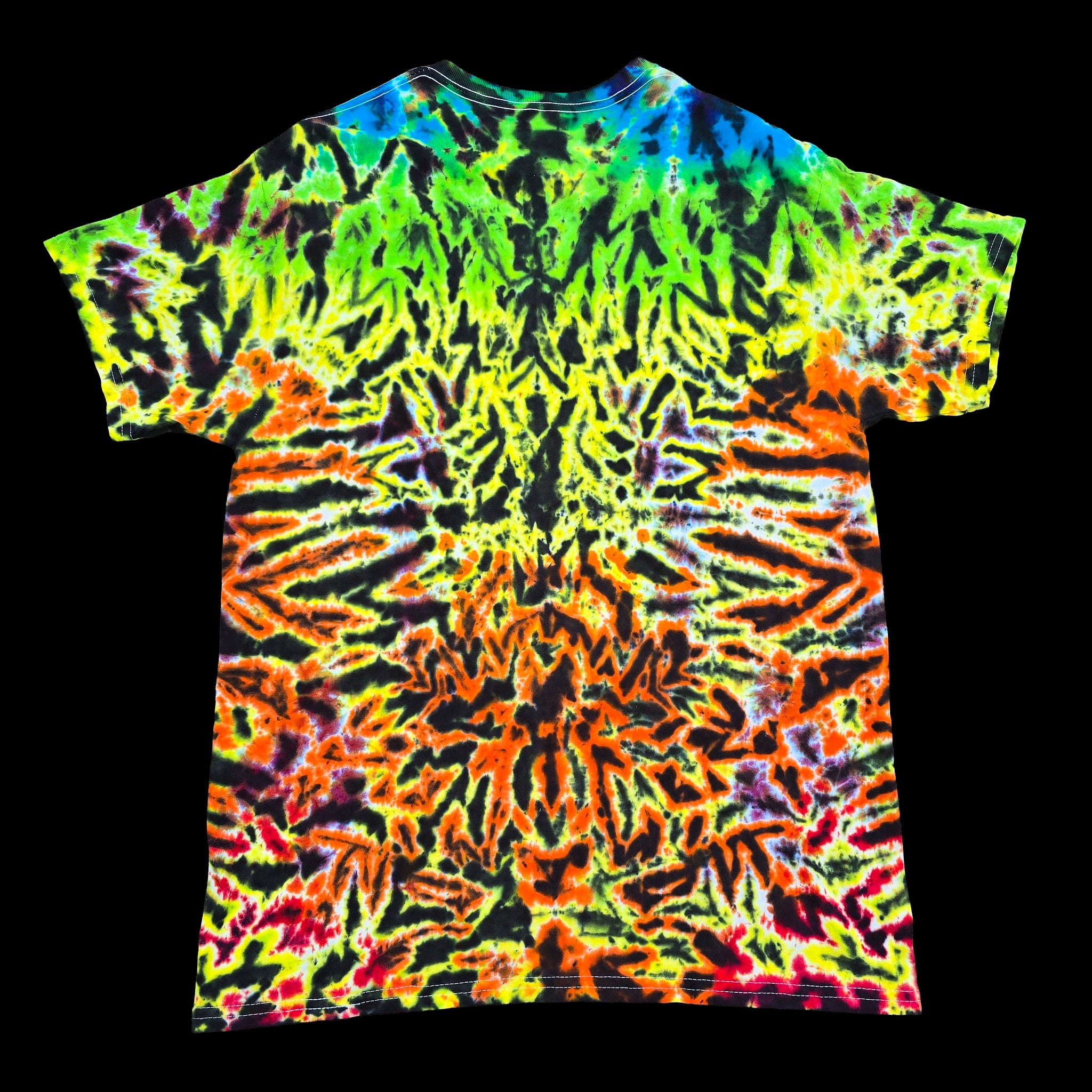 A short-sleeve crewneck t-shirt featuring a vibrant, symmetrical neon tie-dye pattern in green, yellow, orange, red, and blue on a solid black background.