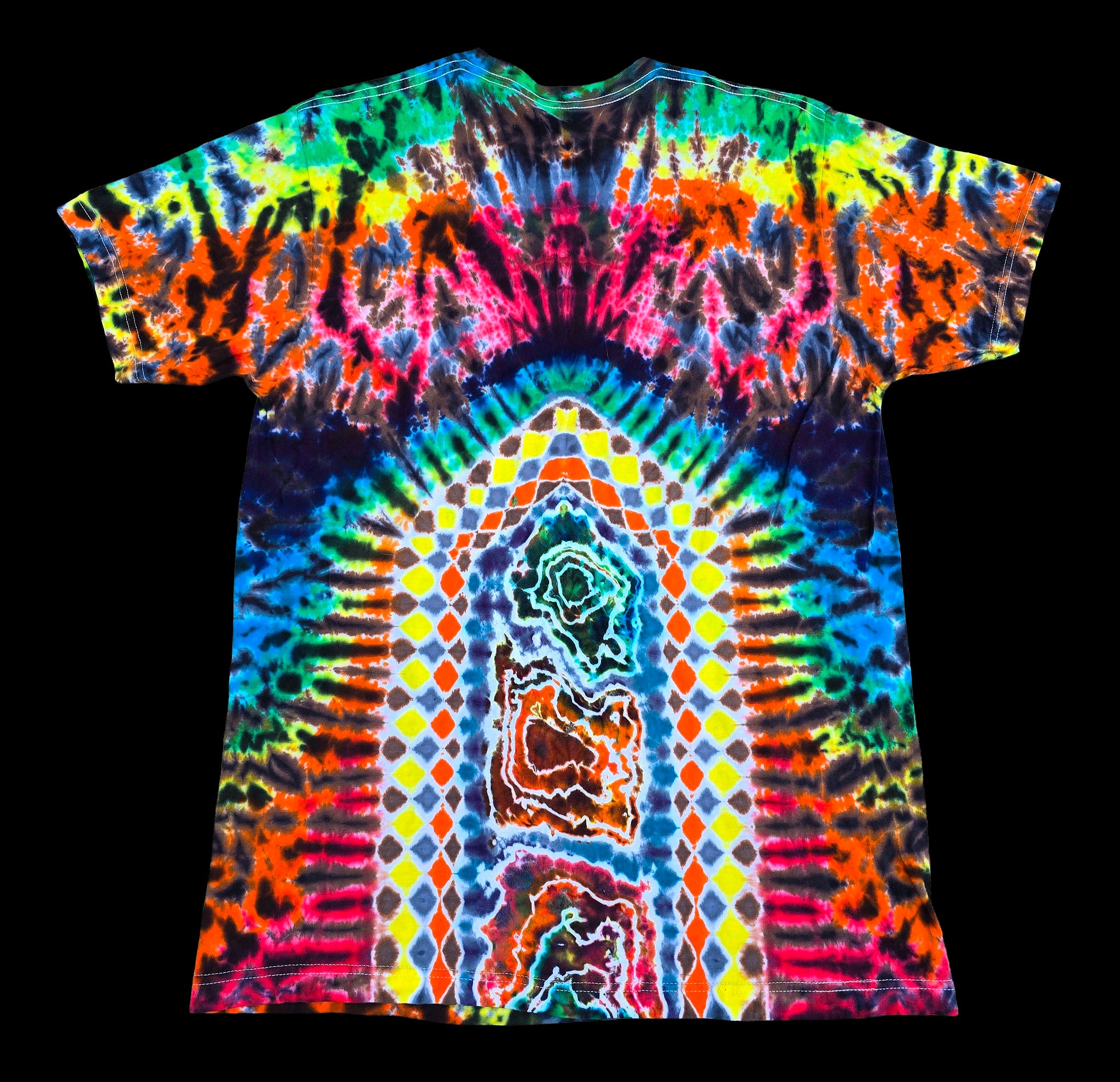 A short-sleeve tie-dye t-shirt with a highly vibrant, psychedelic pattern featuring a central arch of yellow, blue, and green diamonds flanked by rainbow spiral tie-dye effects, shown against a solid black background.