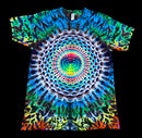 A short-sleeve crewneck t-shirt featuring a vibrant, symmetrical psychedelic mandala print with concentric circles and a rainbow spectrum of colors, shown flat against a solid black background.