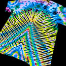 A close-up of a tie-dye garment, likely a shirt or towel, featuring a vibrant psychedelic pattern with radiating stripes and concentric circles in neon yellow, green, blue, pink, and black against a solid black background.