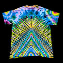 A short-sleeve tie-dye t-shirt with a highly symmetrical, kaleidoscopic pattern featuring bright blue, green, yellow, purple, and black radiating stripes, presented flat against a solid black background.
