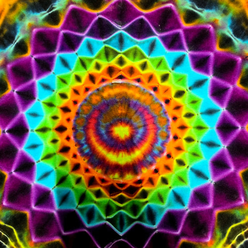 A vibrant, symmetrical psychedelic mandala pattern with concentric rings of neon purple, cyan, green, orange, yellow, and red on a dark background.