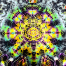 A highly detailed, symmetrical psychedelic mandala pattern with neon yellow, green, purple, and pink glowing linework and smoky gray cloud textures on a dark background.