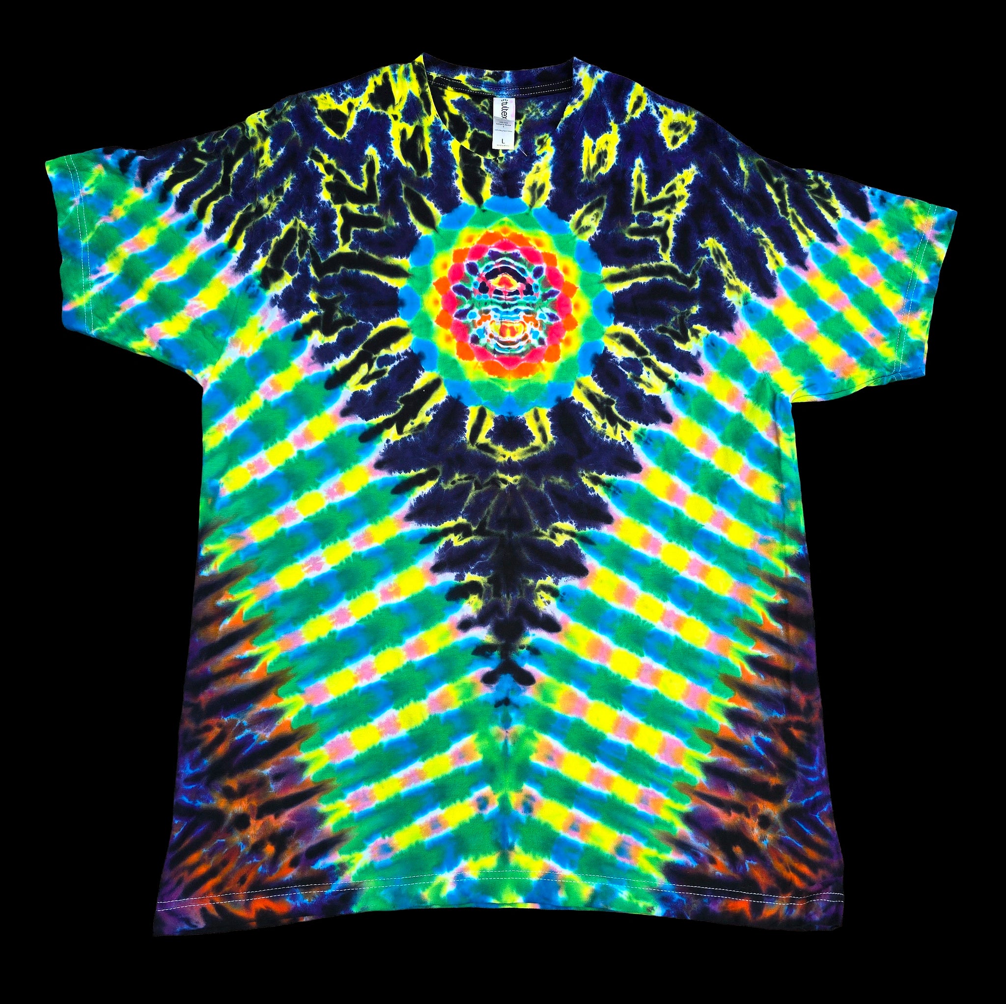 A short-sleeve tie-dye t-shirt with a vibrant psychedelic pattern, featuring a central mandala design and radiating stripes of green, yellow, blue, and purple on a black background.