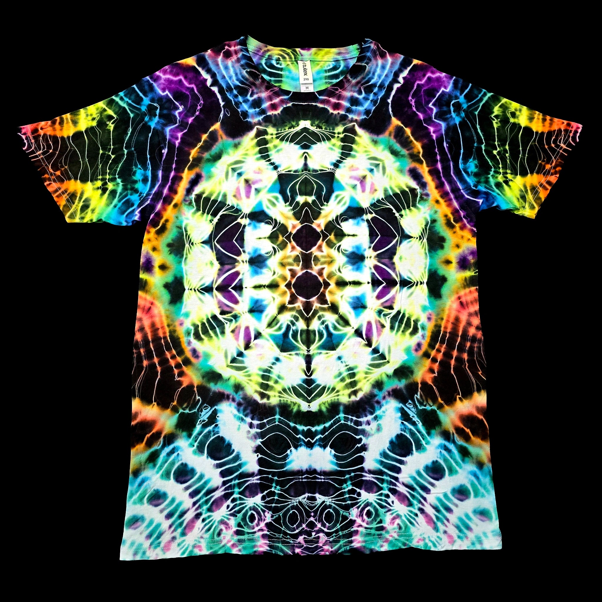 A short-sleeve crewneck t-shirt featuring a vibrant, symmetrical kaleidoscopic tie-dye pattern with neon colors.