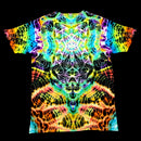 A short-sleeve crewneck t-shirt featuring a vibrant, symmetrical psychedelic kaleidoscope pattern with neon rainbow colors.