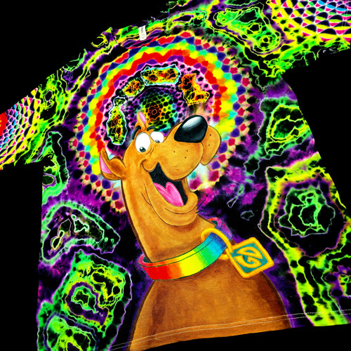 Front angled perspective view of tie dye shirt showing Scooby-Doo graphic and green geode side details