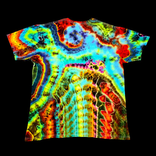 A short-sleeve crewneck t-shirt featuring a vibrant, psychedelic tie-dye pattern with swirling bands of neon blue, green, yellow, orange, and red on a black background.