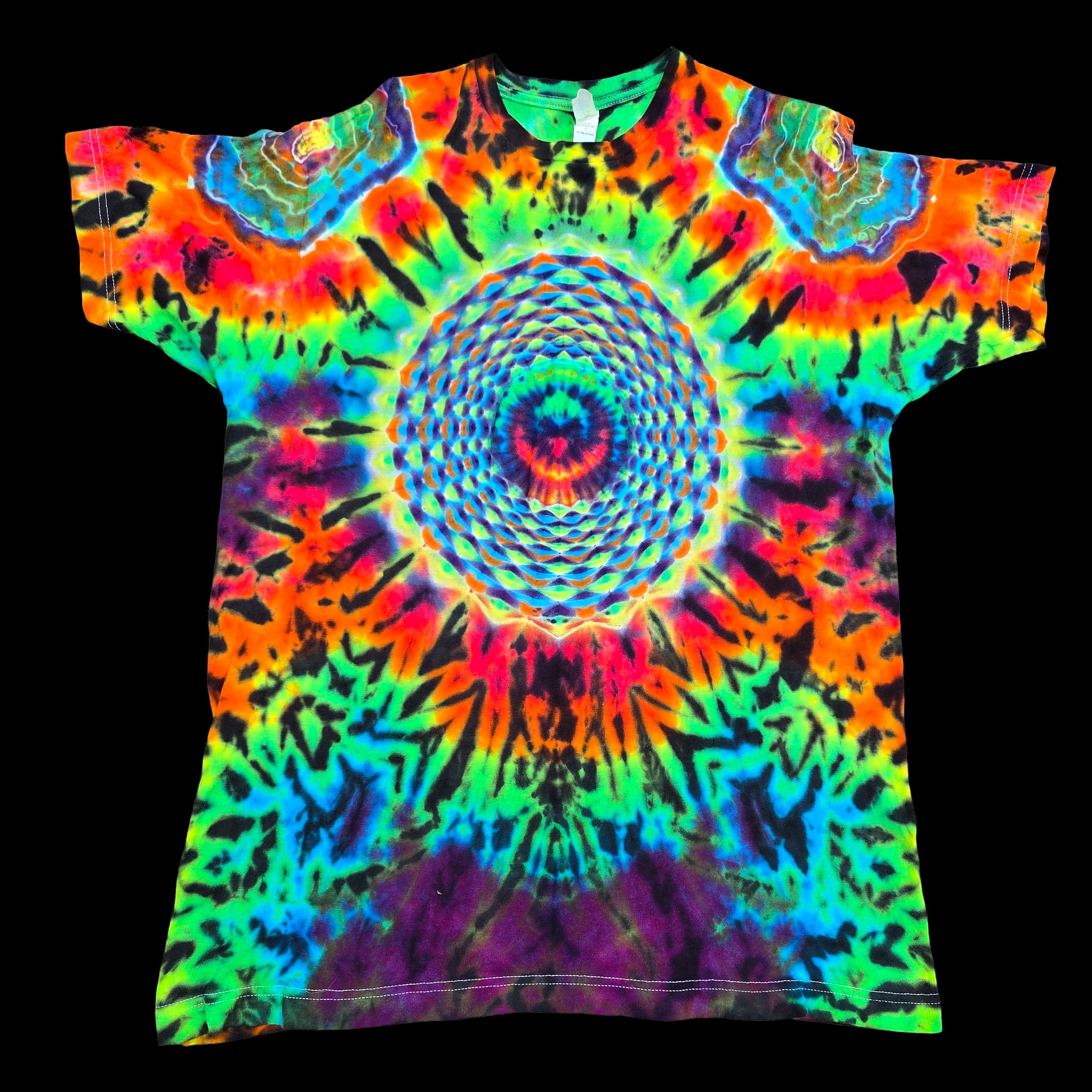 A short-sleeve tie-dye t-shirt featuring a vibrant, symmetrical psychedelic spiral pattern in neon green, blue, orange, yellow, pink, and purple on a black background.