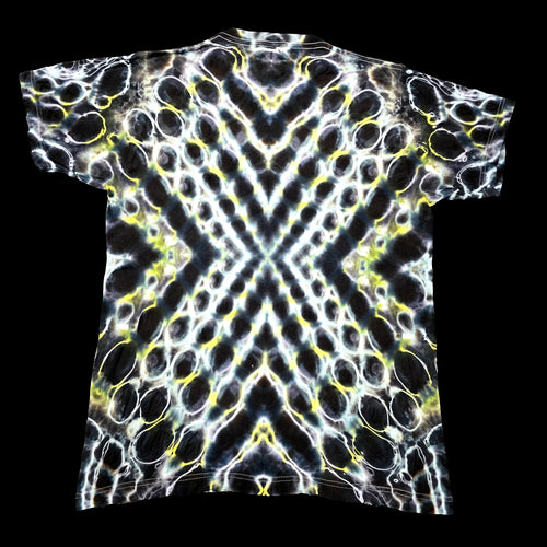 A short-sleeve t-shirt with a symmetrical, kaleidoscopic abstract pattern in black, white, and neon yellow.