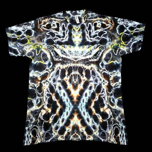 A short-sleeve crewneck t-shirt featuring a highly detailed, symmetrical psychedelic abstract pattern in black, white, yellow, and orange.