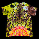A short-sleeve tie-dye t-shirt with a highly symmetrical, psychedelic design. The top half features a dark brown and black spiderweb-like pattern on a bright yellow background, while the bottom half transitions into a vibrant neon mandala with yellow, pink, and red concentric shapes.