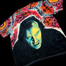 Front angled perspective view of tie dye shirt showing Jack Nicholson face art and red agate sleeve details