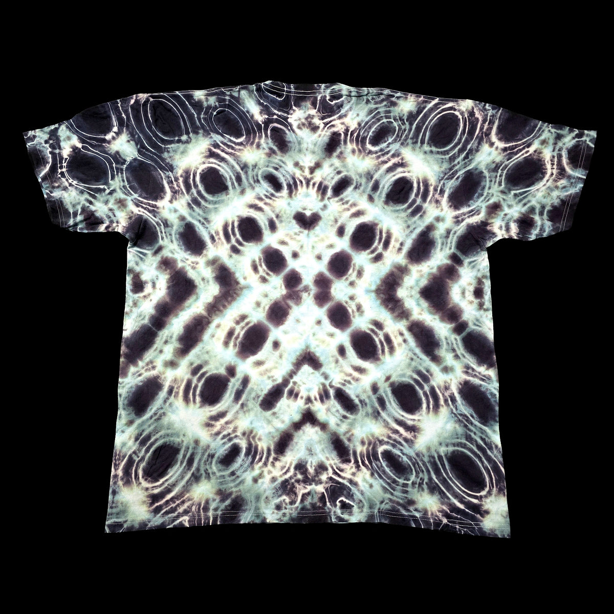 A short-sleeve t-shirt with an all-over psychedelic tie-dye pattern of black, white, and pale green concentric circles, shown flat against a solid black background.
