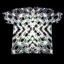 A short-sleeve crewneck t-shirt featuring a symmetrical, kaleidoscopic abstract pattern of black, white, and pale green circles, photographed flat against a solid black background.