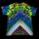A short-sleeve crewneck t-shirt featuring a vibrant, symmetrical tie-dye pattern with neon green, yellow, blue, purple, pink, and orange, displayed flat against a solid black background.