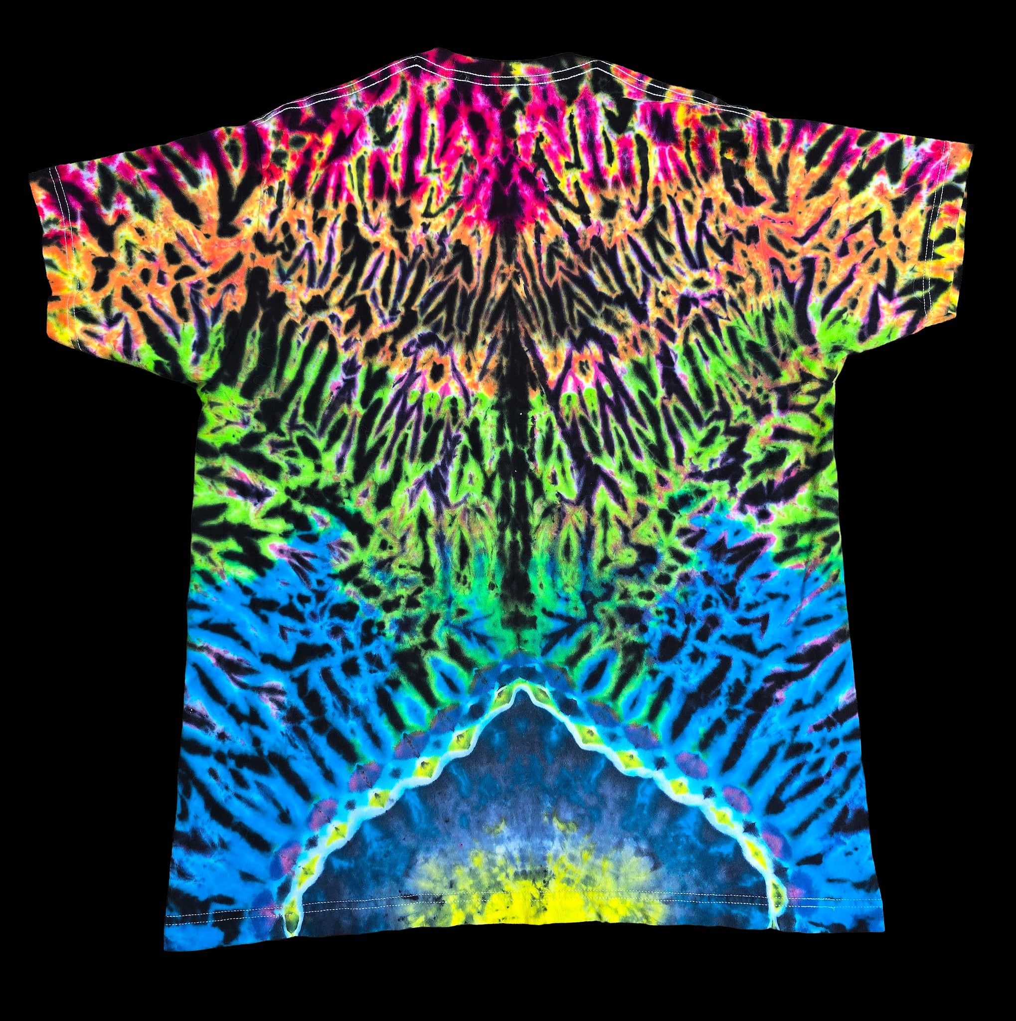 A short-sleeve crewneck t-shirt featuring a vibrant, symmetrical neon tie-dye pattern with multiple colors including pink, orange, yellow, green, blue, and purple on a black base, shown against a solid black background.