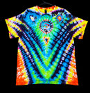 A vibrant tie-dye t-shirt with a symmetrical mandala design, featuring neon blue, green, yellow, orange, and purple patterns, hanging on a black hanger against a solid black background.