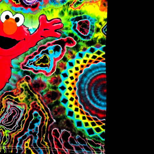 A highly vibrant, psychedelic tie-dye pattern featuring the character Elmo on the left, with swirling neon colors including green, yellow, blue, red, and pink, alongside a geometric mandala design on the right side.