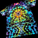 A short-sleeve crewneck t-shirt featuring a vibrant, neon psychedelic tie-dye mandala pattern on a black base, shown against a solid black background.